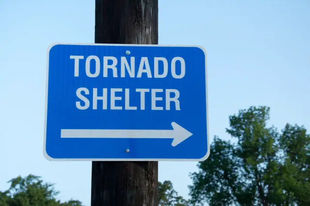 Sign Pointing to Tornado Shelter